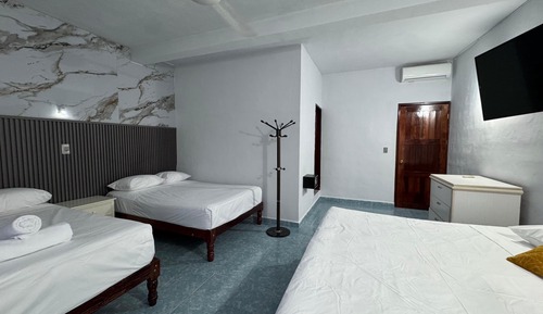 Habitación triple familiar, balcón, vistas al jardín