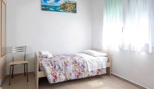 Habitación triple, vistas al patio