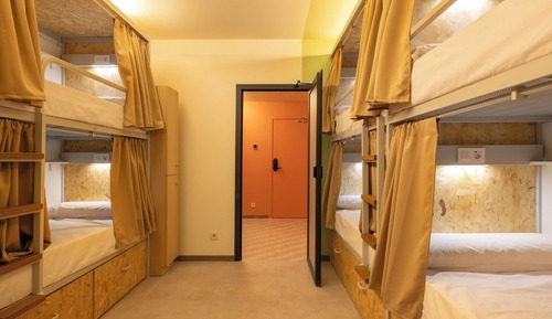 Bed in 8-bed female dormitory room