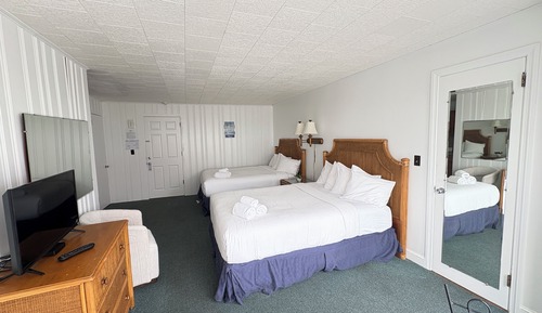 Habitación superior, 2 camas de matrimonio, vistas parciales al mar