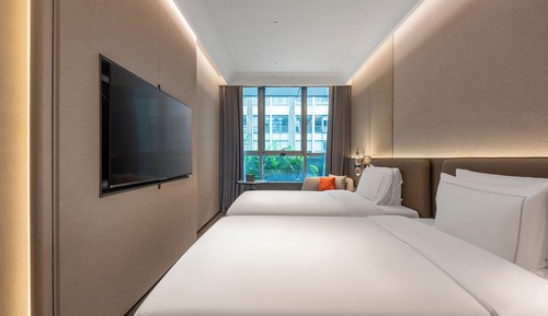 Habitación superior con 2 camas individuales, vistas a la ciudad