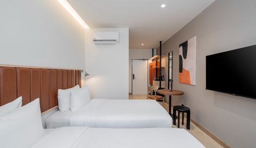 Habitación superior con 2 camas individuales, vistas a la ciudad