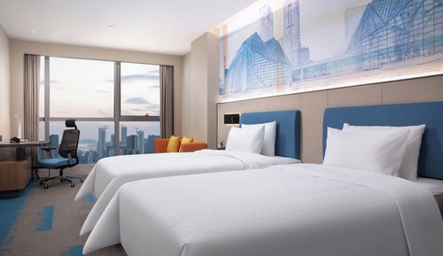 Habitación superior con 2 camas individuales, vistas a la ciudad