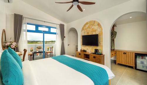 Habitación Deluxe doble, 1 cama de matrimonio grande, vistas parciales al mar