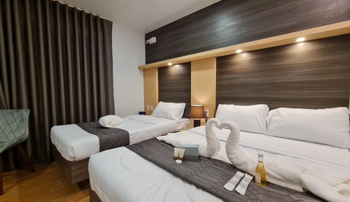 Habitación triple Deluxe, vistas a la ciudad