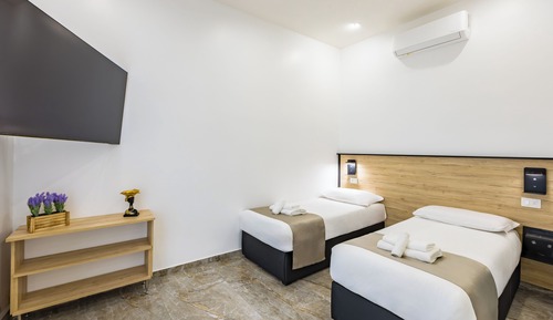 Habitación Confort con 1 cama doble o 2 individuales