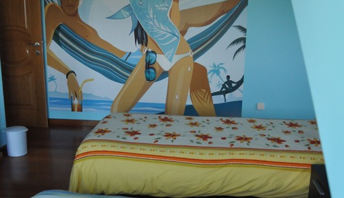 Habitación cuádruple Deluxe, vistas parciales al mar