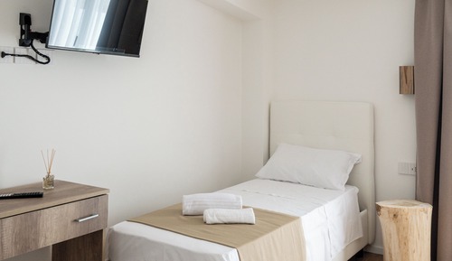 Habitación triple, vistas al mar