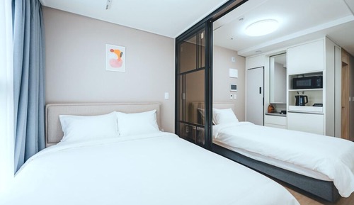 Habitación familiar con 2 camas individuales, vistas a la ciudad