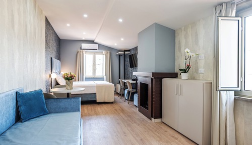Habitación cuádruple Deluxe, varias camas