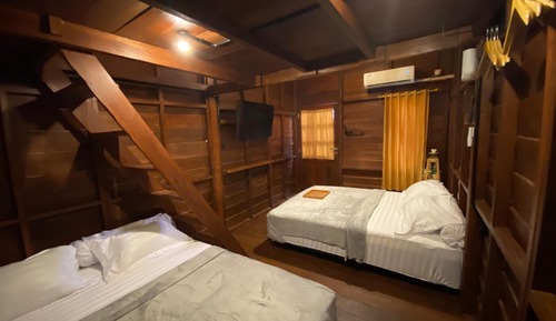 Habitación triple familiar, varias camas, vistas al campo de golf