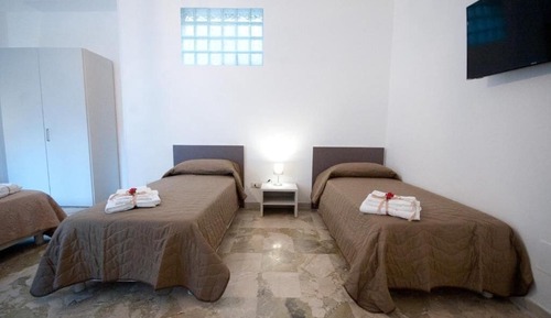 Habitación cuádruple Deluxe, varias camas, patio