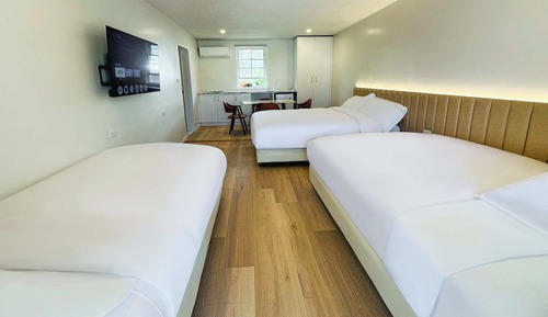 Habitación cuádruple Elite, varias camas