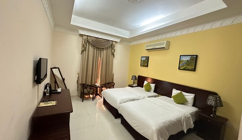 Habitación estándar con 2 camas individuales, 1 cama individual, no fumadores, vistas al jardín