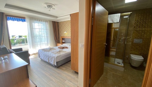 Habitación triple, vistas al mar