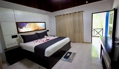 Habitación individual Signature, 1 cama de matrimonio grande, Aire acondicionado, vistas al jardín