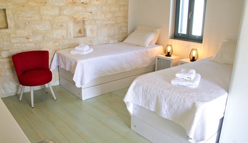 Habitación Elite con 1 cama doble o 2 individuales
