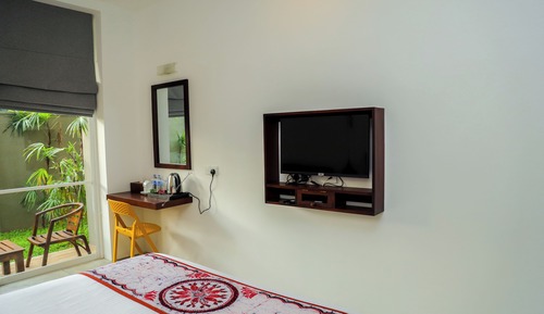 Habitación triple superior, vistas al jardín