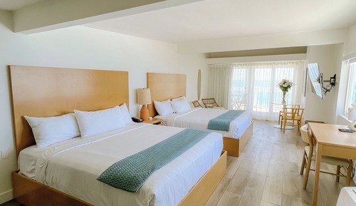 Suite, varias camas, frente al mar (Ocean Front Junior Suite 2 King Beds)