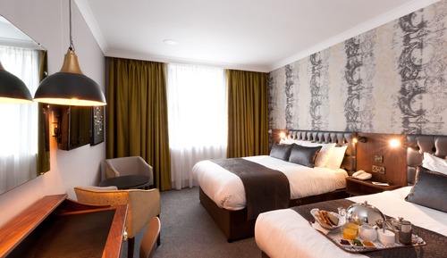 Habitación triple Deluxe, varias camas