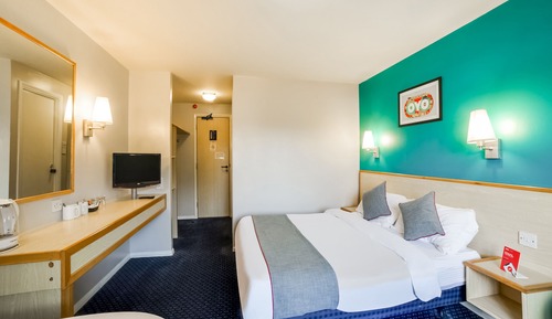 Habitación triple Deluxe, varias camas