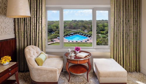 Deluxe Room King Bed Forest and Pool View