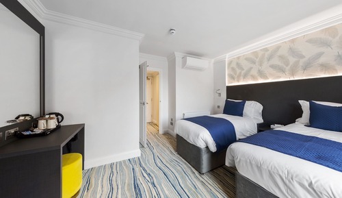 Habitación triple ejecutiva, varias camas