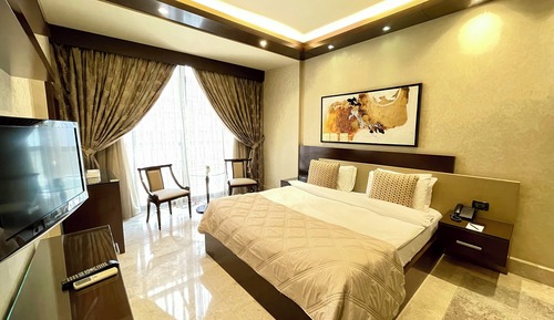Suite ejecutiva, 1 cama de matrimonio grande, vistas a la ciudad