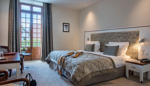 Habitación estándar con 1 cama doble o 2 individuales, en la zona del jardín