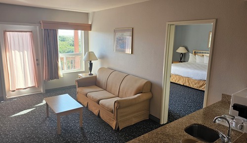 Suite familiar, varias camas, chimenea, vistas parciales al mar