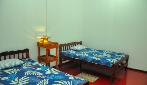 Habitación triple, varias camas