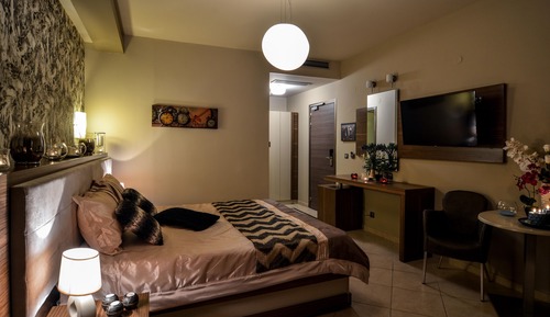 Habitación triple Deluxe, vistas parciales al mar