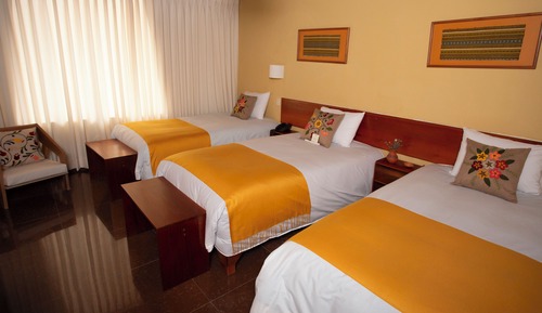 Habitación triple, vistas al jardín