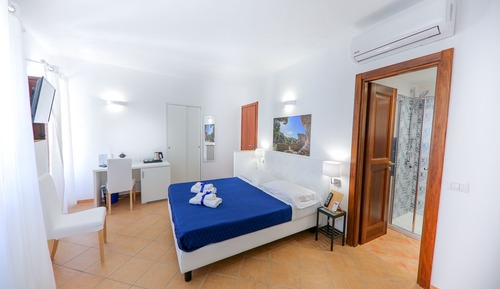 Habitación triple, vistas al mar