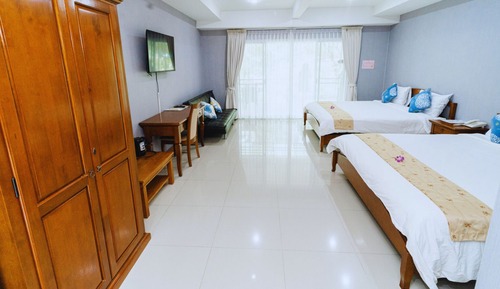 Habitación Deluxe con 1 cama doble o 2 individuales, en la zona del jardín