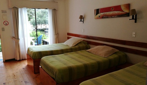 Habitación triple, varias camas