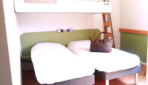 Habitación triple, varias camas