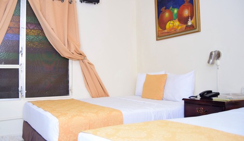Apartamento familiar con 2 camas queen y aire acondicionado