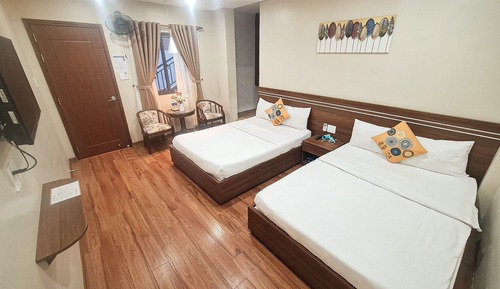 Habitación cuádruple familiar, 2 camas dobles, fumadores, vistas al jardín