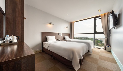 Habitación estándar con 2 camas individuales, varias camas