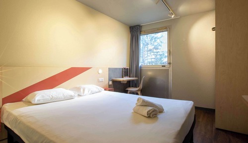 Habitación triple, varias camas