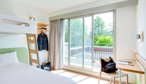 Habitación triple, varias camas