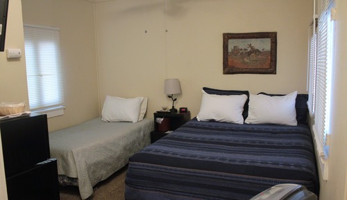 Habitación junior, frigorífico y microondas, vistas al patio