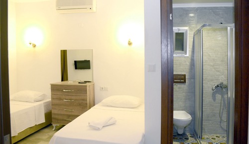 Habitación triple, varias camas