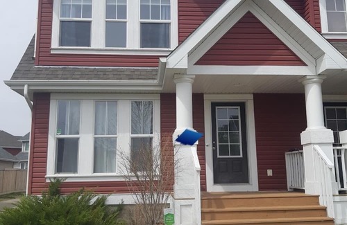 Southeast Edmonton Casa | House in Summerside with a huge patio and an extra tall garage