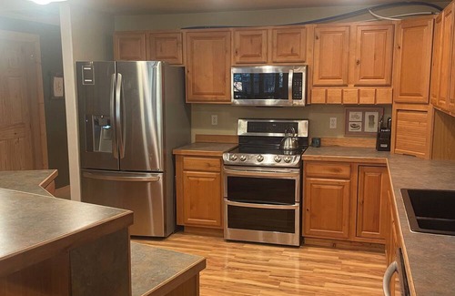 Joseph Cabina | Cozy cabin on a quiet dead end street with a large deck and outdoor kitchen
