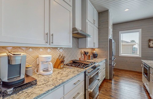 Port Aransas Casa | KD671 Luxurious Home with Private Heated Pool and Oasis, Partial Gulf Views and Golf Cart Included!