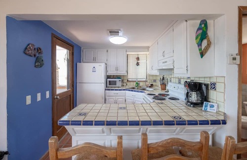 Las Conchas Casa | Arena y Sol - Vibrant two story home with colorful atmosphere
