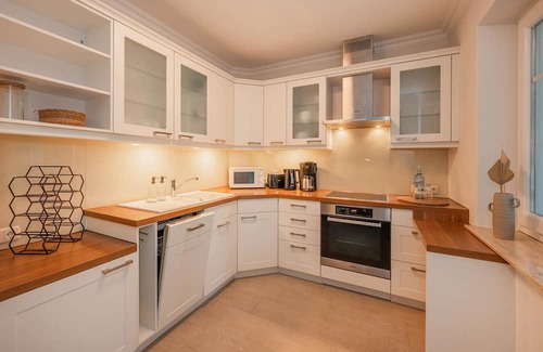 Zinnowitz Apartamento | Quartier am Kirchberg - 02 - quiet residential complex with conservatory and fireplace