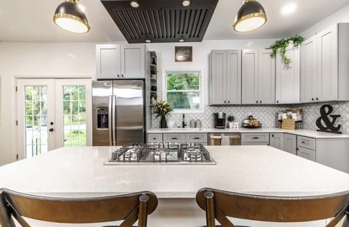 Mickleton Casa | Embrace the charm of our creekside haven featuring 4BR 3BA yoga and BBQ deck.